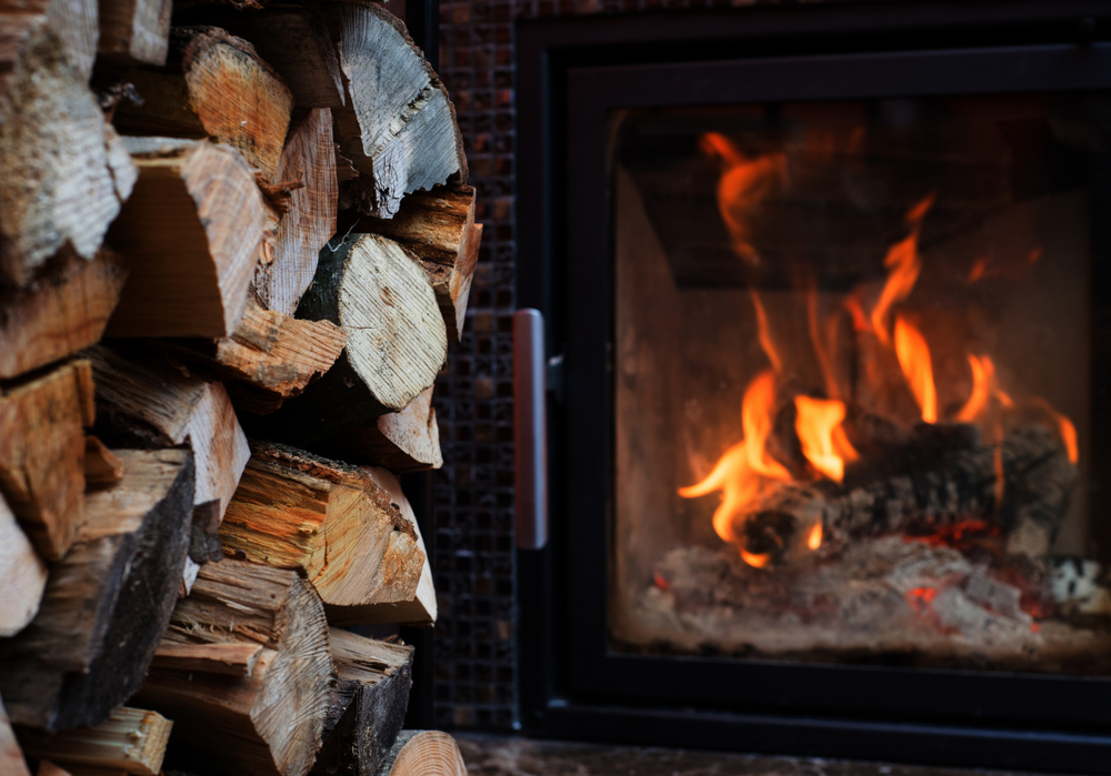 Fireplace,with,stack,of,firewoods